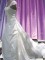 gown made from silk with lace inlay on side and roushed lace across front