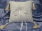 silk satin ring cushion with tassels and satin ribbons.