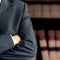Businessman in front of books