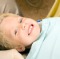 Child Boy Smiles after Dental Cleaning