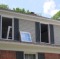 Replacement Windows Being Installed in House