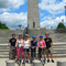 urban adventour group in front of monument